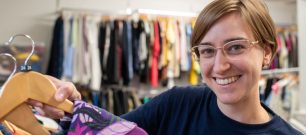 Shop volunteer with garment