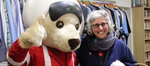 Volunteer with DAA mascot, Ambrose bear