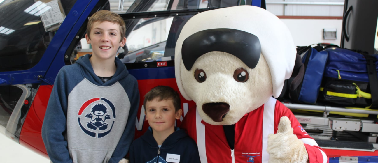 Young patient, Harry Tansley with his brother and DAA mascot Ambrose