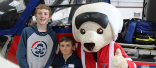 Young patient, Harry Tansley with his brother and DAA mascot Ambrose