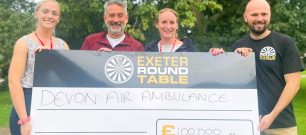 Exeter Round Table and Devon Air Ambulance team with £100k cheque