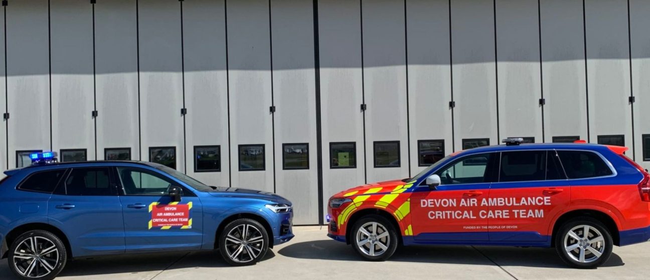 Devon air ambulance critical care cars by aircraft hanger