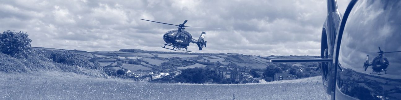 Devon Air Ambulance aircraft in flight and in field