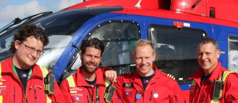 Crew members with aircraft