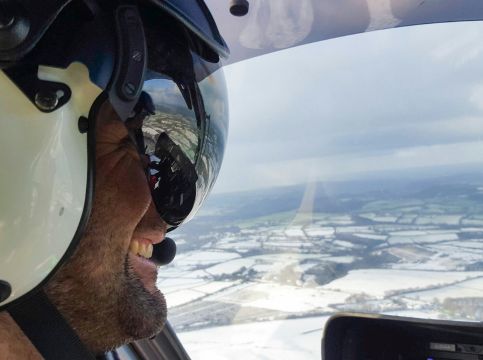 A pilot overlooking a snowy scene