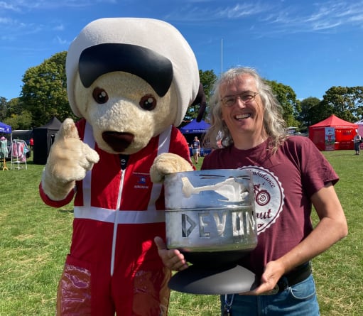 Former patient Lee with DAA mascot, Ambrose