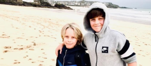 Patient Noah with his brother on the beach